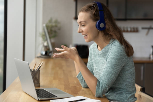 istock Happy gen Z student girl watching webinar, speaking at webcam 1335027139