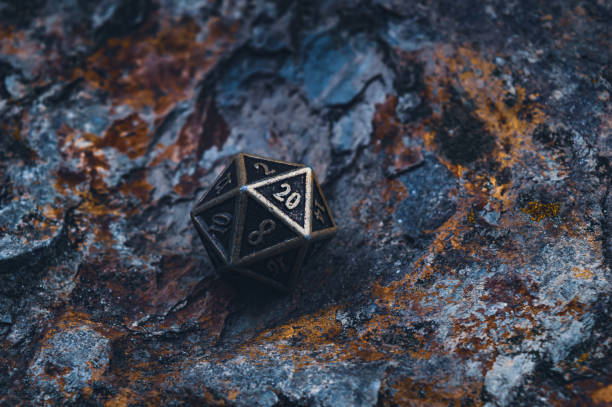 istock An image of a metallic d20 on a rocky surface 1335027140