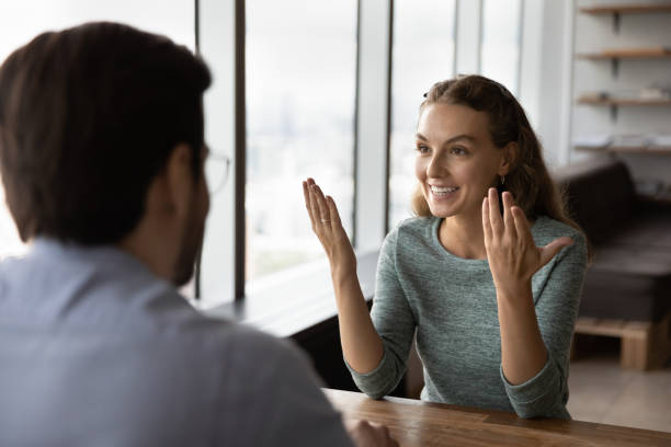 istock Happy confident candidate telling about experience at job interview 1335027233