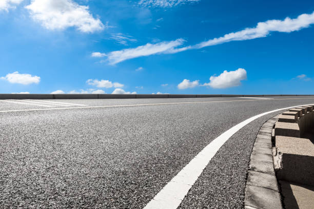 istock Empty and clean asphalt road and sky landscape in summer 1335029785