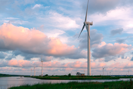 Wind turbine beside Dongtai river pond in Yancheng, Jiangsu Province