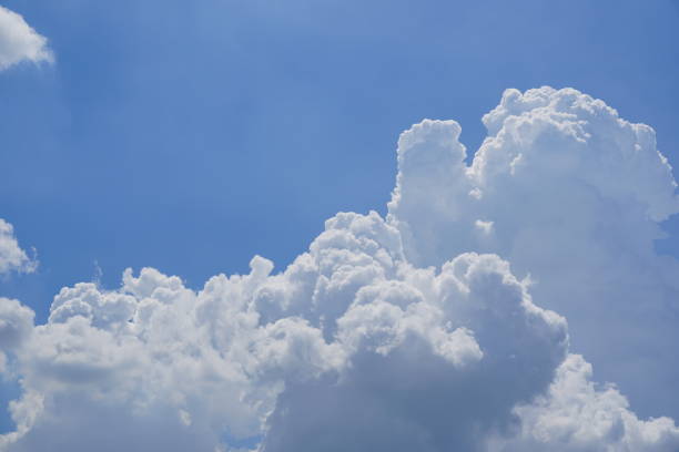 istock Blue sky background with white clouds in nature 1335033252