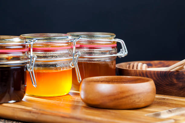 istock flower honey from different varieties of flowers, bottled in different cans 1335035318