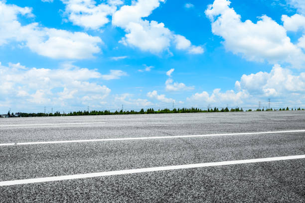 istock Empty and clean asphalt road and sky landscape in summer 1335035504