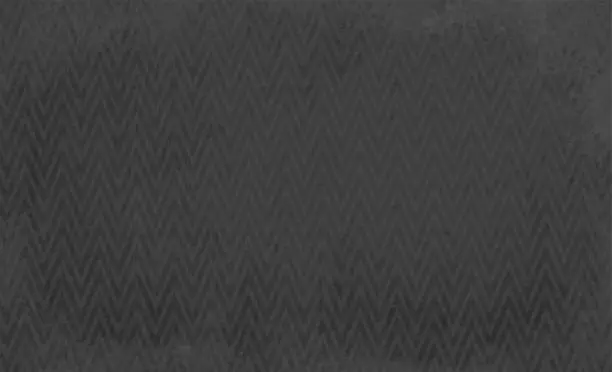 Vector illustration of Black coloured vector grunge textured effect background with a woven or interlocked pattern of grid of grey zig zag chains