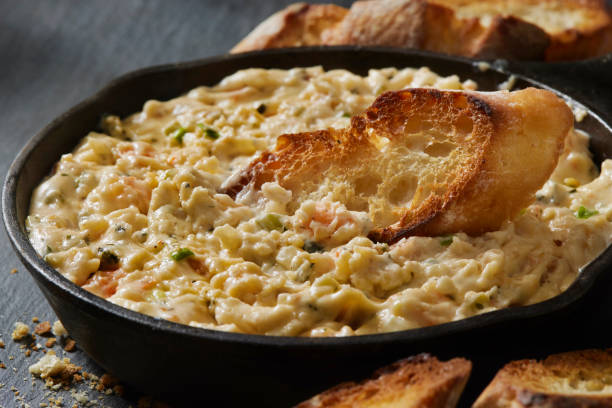 istock Cheesy Shrimp Dip with Toasted Crostini's 1335040359