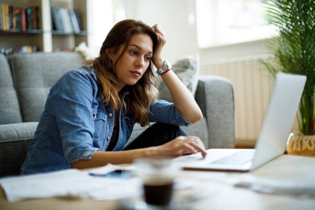 istock Worried young woman working at home 1335043752