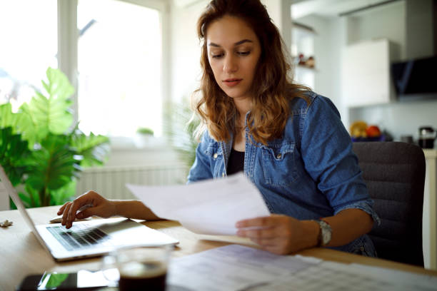 istock Serious young woman working from home 1335044242