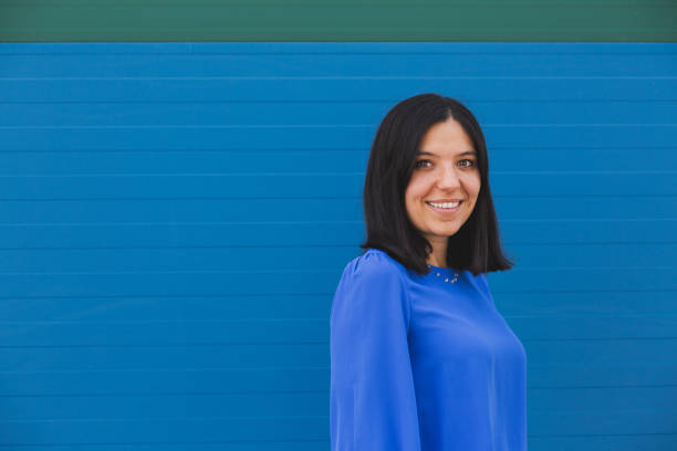 istock Young beautiful woman in blue. 1335044605