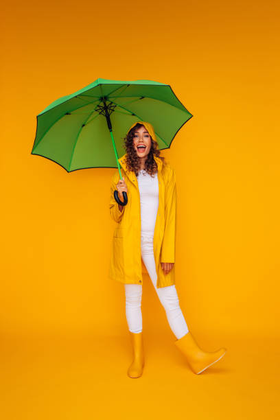 istock Girl with green umbrella 1335044778