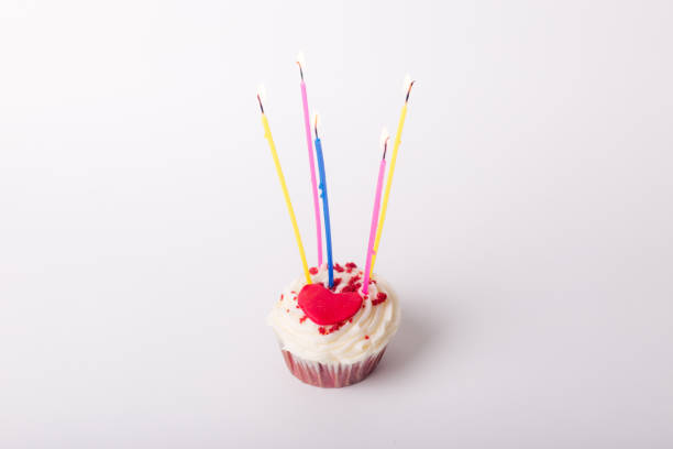 istock Birthday cupcake with a red heart and candles 1335044879