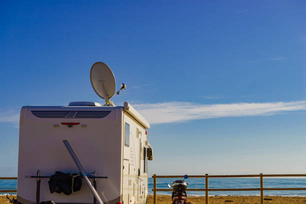 istock Satellite dish on roof of caravan 1335045813