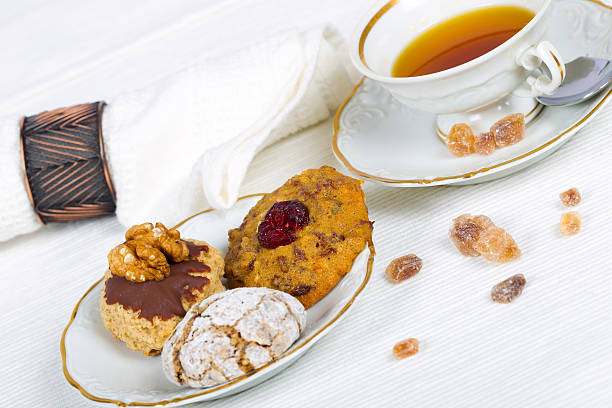 Cup of tea, serviettes and cookies stock photo