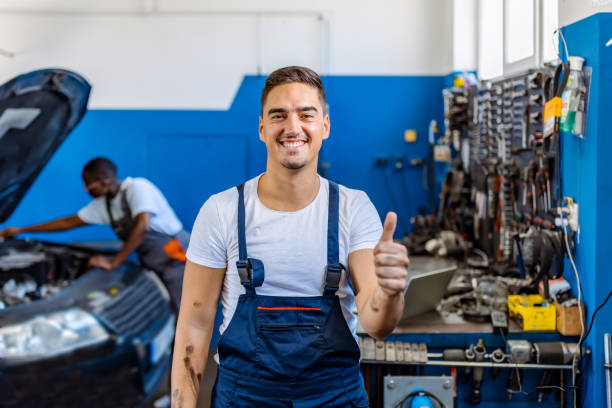 istock Smiling mechanic giving thumbs up 1335050375