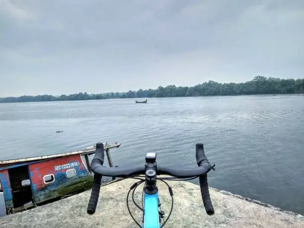 Cycling a road bike to seaside pier looking for a dock