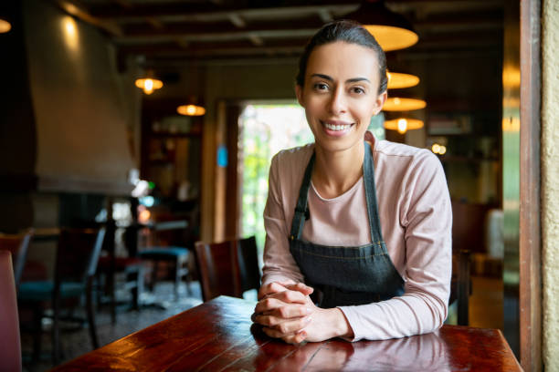 istock Happy waitress working at a restaurant 1335052511