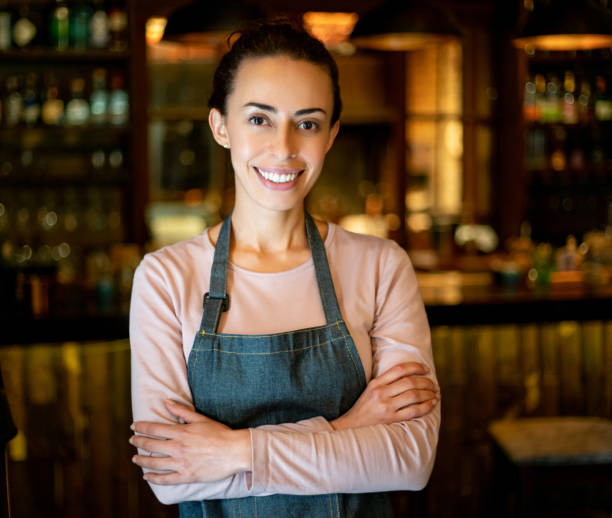 istock Happy waitress working at a restaurant 1335052551