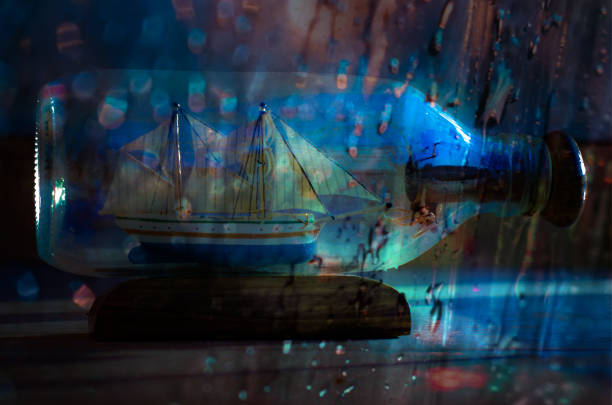 istock Sailboat in a bottle in thunderstorm 1335053903