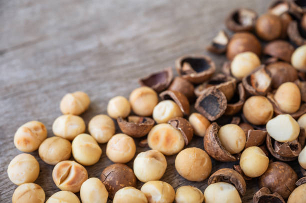 istock Pile of peeled Macadamia nuts on wooden table 1335055307