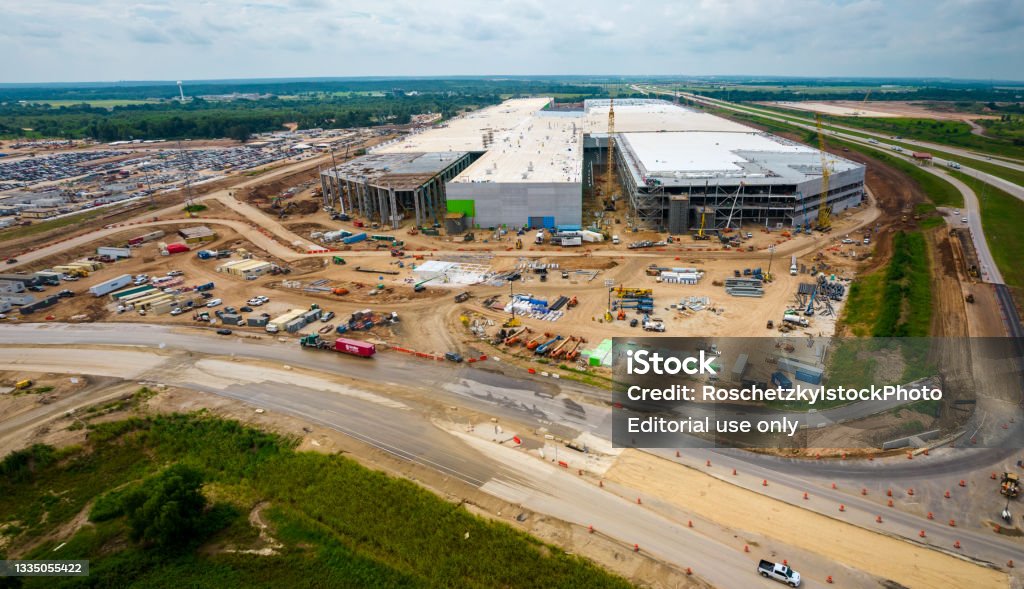 Tesla Gigafactory Austin or known as GigaTexas aerial view shows condturction progress and the 4680 battery factory almost complete Austin , Texas , USA - August 30th 2021:  Amazing aerial drone views from above GigaTexas show the construction progress of the Factory that will make the Tesla Modlel Y qnd then the Cybertruck and maybe tesla Semi and Tesla Bot Factory Stock Photo