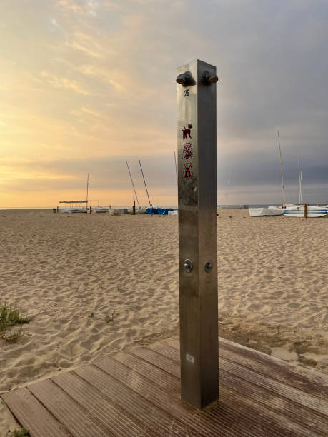 a single shower at the beach at sunset in Comarruga, Tarragona, Spain. High quality photo