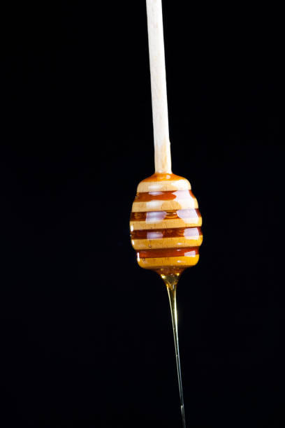 istock current thick and delicious sweet honey, close up 1335058342