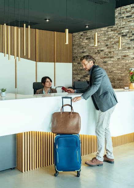 istock Handsome Business Man Checking In at Hotel 1335061112