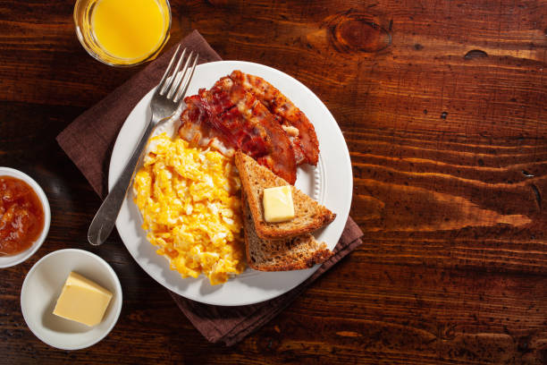istock traditional scrambled egg breakfast with bacon and toast 1335061938