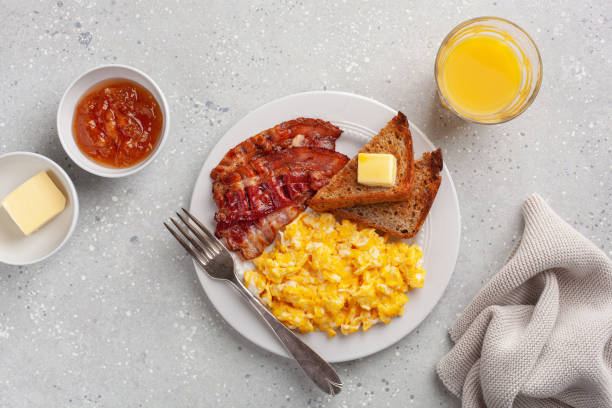 istock traditional scrambled egg breakfast with bacon and toast 1335062065