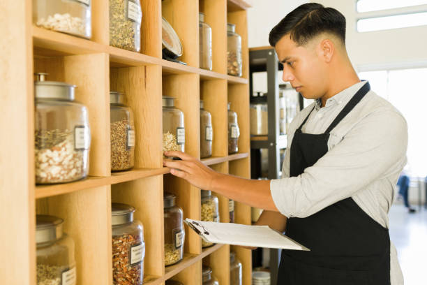 istock Worker looking at the prices at the bulk shop 1335067968