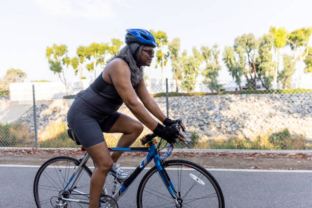 istock Senior Black Woman Riding Bicycle 1335068750