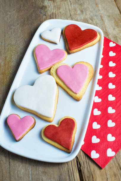 istock Heart shaped cookies on wooden table 1335069262