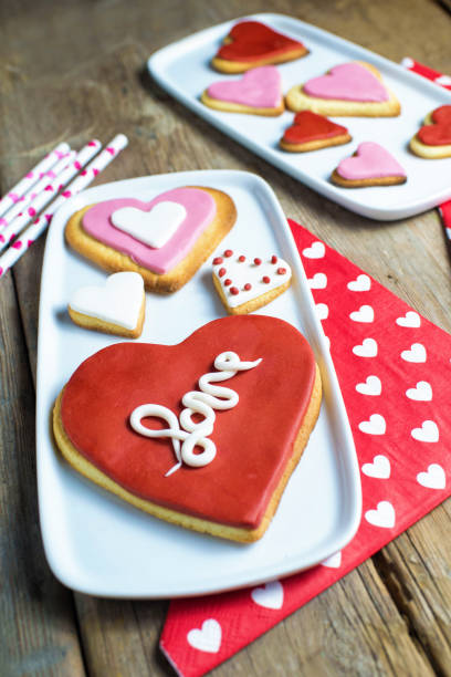 istock Heart shaped cookies on wooden table 1335069275