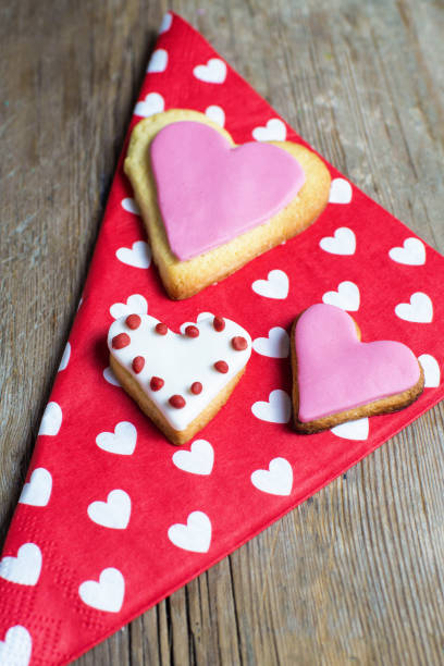 istock Heart shaped cookies on wooden table 1335069296
