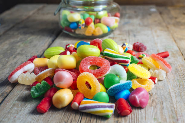 Colorful candy gum on old wooden table stock photo