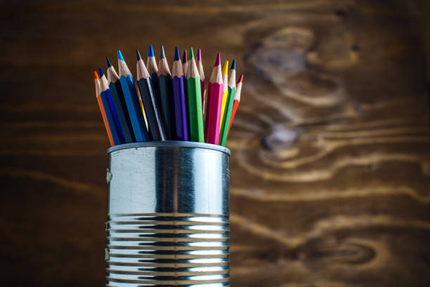 istock Colored pencils on wooden table 1335070235