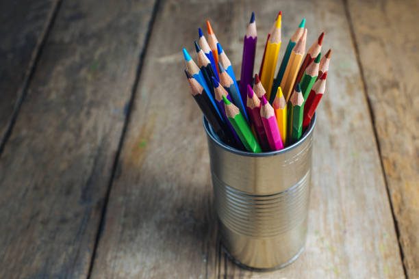istock Colored pencils on wooden table 1335070241