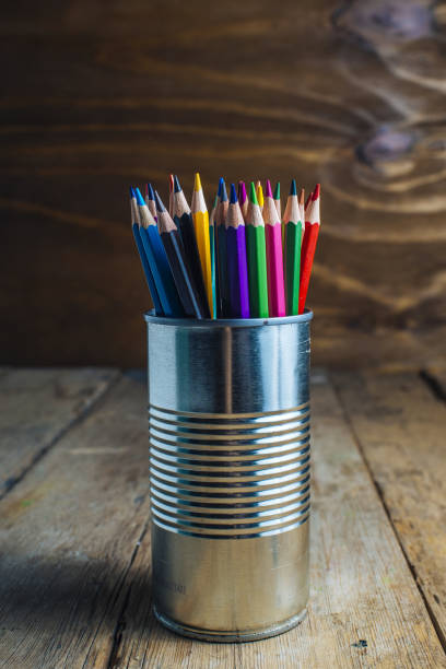 istock Colored pencils on wooden table 1335070243