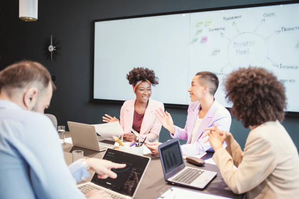 istock Group of Businesspeople Having a Discussion in an Office 1335074632