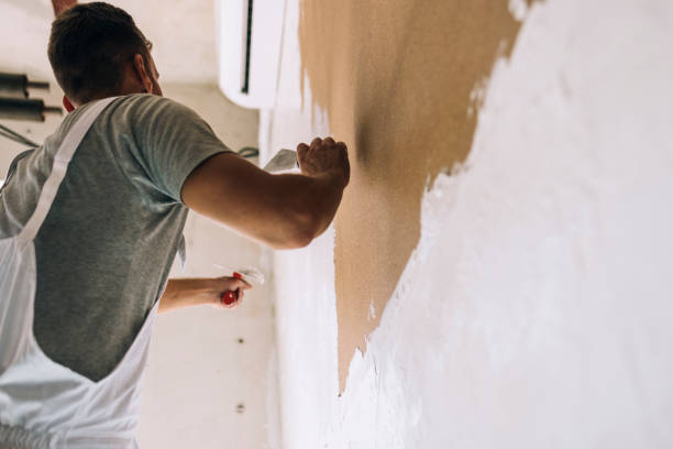 istock An Anonymous Man Plastering Wall with Spatula at Home 1335074884