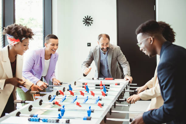 istock Coworkers Playing Table Football 1335075492