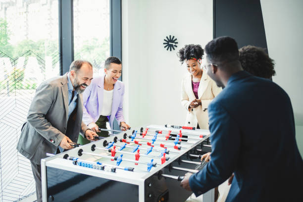 istock Coworkers Playing Table Football 1335075496