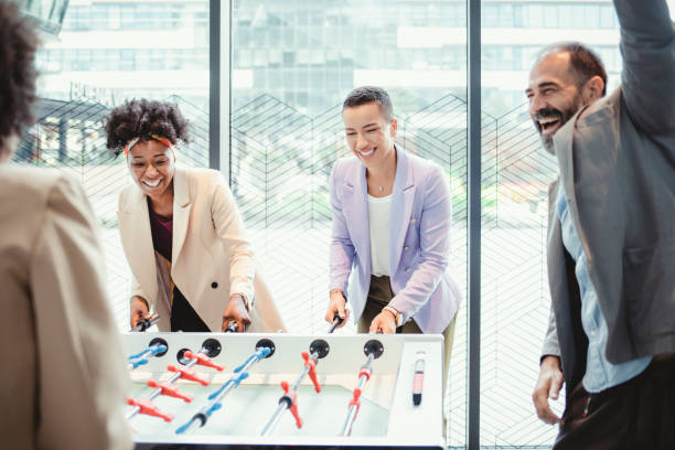 istock Office People Enjoying Table Soccer 1335075534
