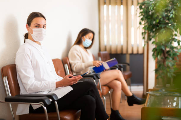 istock Positive woman waiting at hall at office 1335077177