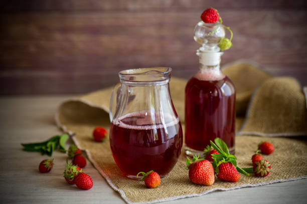 istock sweet cooked strawberry syrup in a glass decanter 1335079763