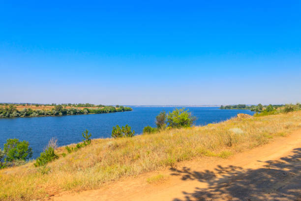 istock Summer landscape with beautiful river, green trees and blue sky 1335079831