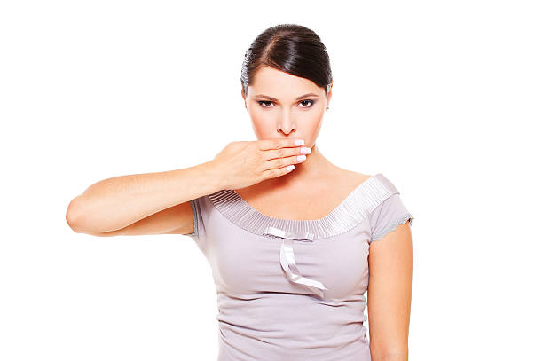 istock serious woman covering her mouth 133508089