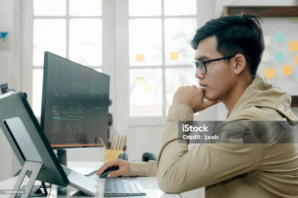 Programmers and developer teams are coding and developing software Programmers and developer teams are coding and developing software. Computer Programmer Stock Photo