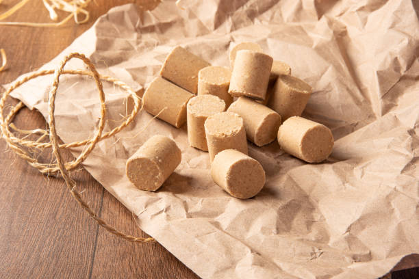 istock Peanut candy (paçoca or pacoca) Traditional Brazilian peanut-based candy, arranged on brown paper on a table. Selective Focus. 1335083327