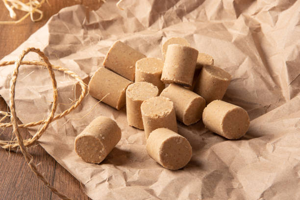 istock Peanut candy (paçoca or pacoca) Traditional Brazilian peanut-based candy, arranged on brown paper on a table. Selective Focus. 1335083328